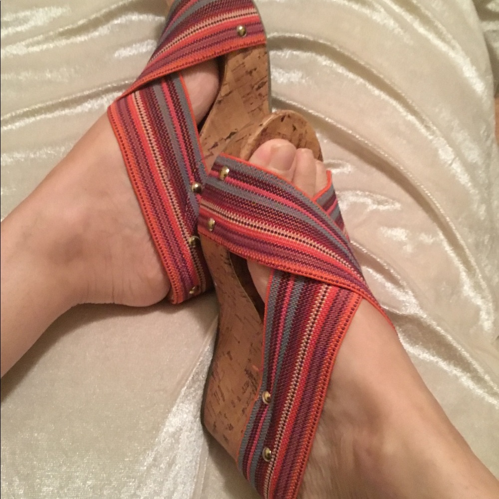 Cork wedge heal with elastic uppers.